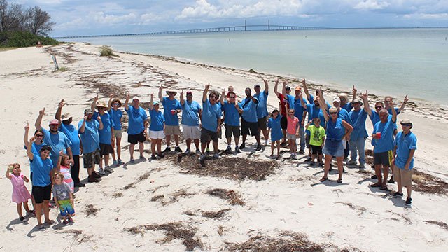 Convergint day Tampa group gathering photo on beach