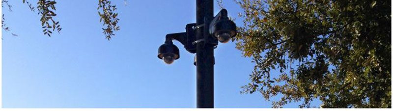 Surveillance_Edited security cameras on a light post