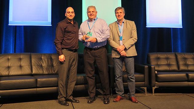 Convergint-genetec-NA-account-of-the-year_Edited Tony Varco receiving award on stage for Genetec NA account of the year header image