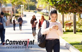 Students Walking Outdoors On University Campus