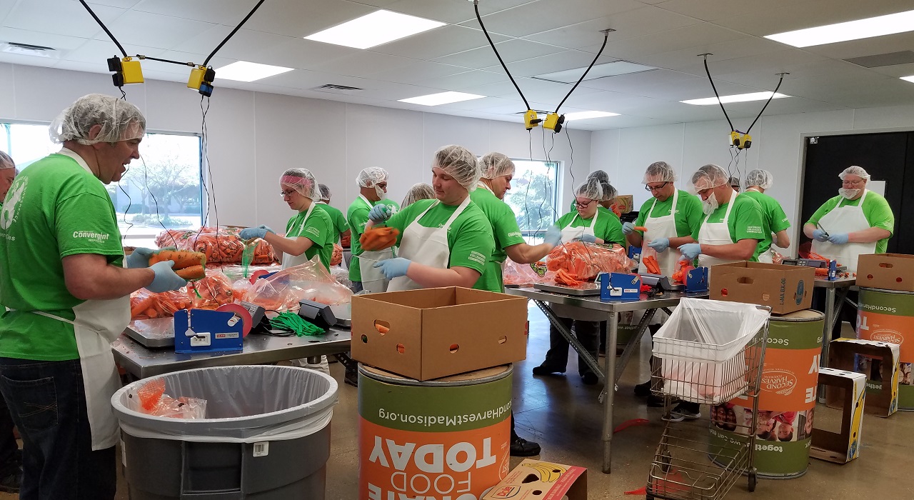Colleagues preparing meals at a food bank