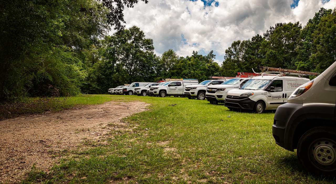 Convergint vans lined up near the day's worksite