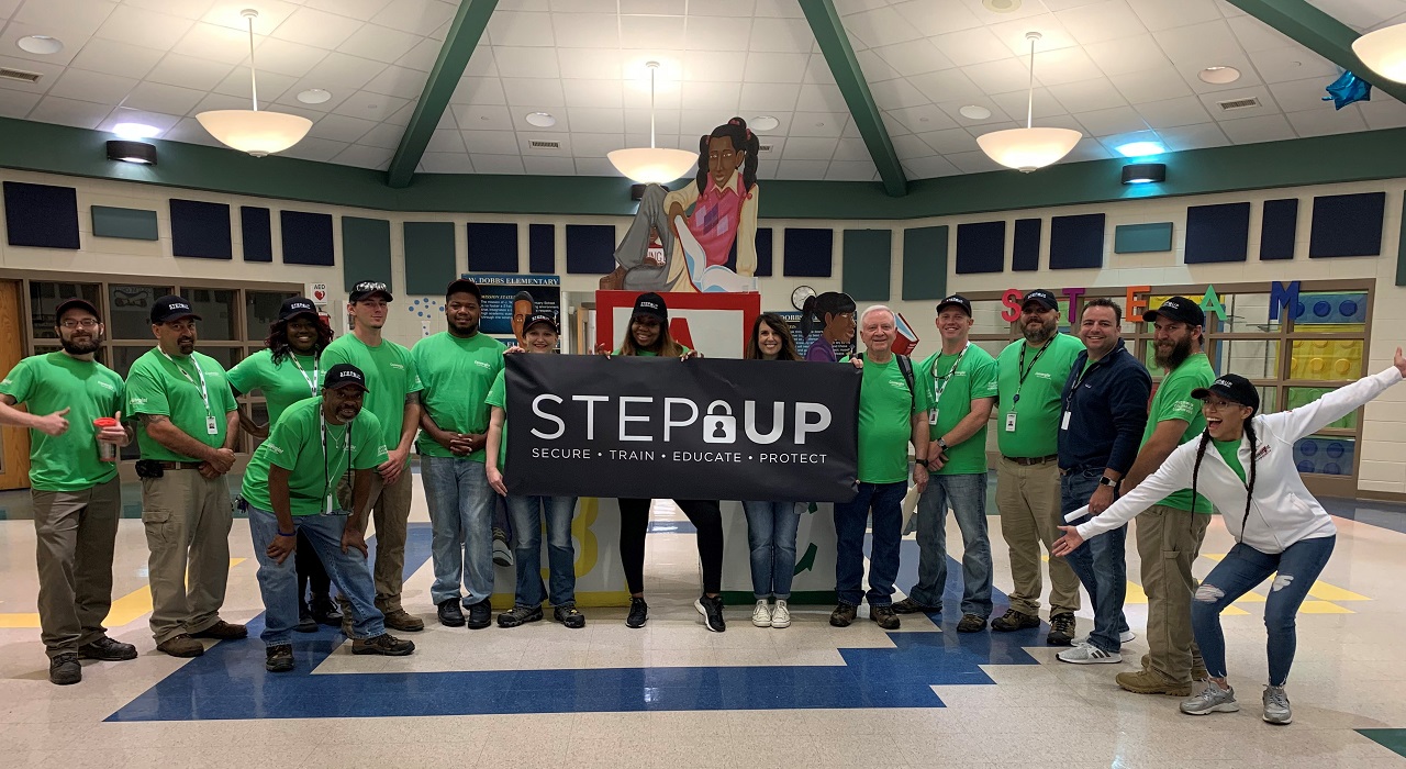 Colleagues pose in Atlanta school