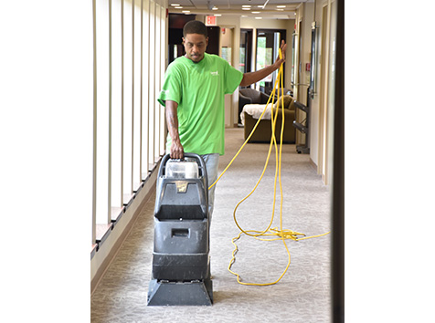 Man cleaning carpet