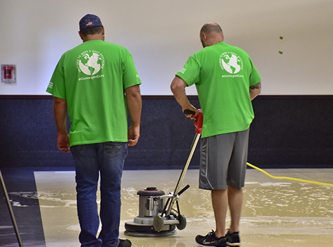 Men cleaning gym floor