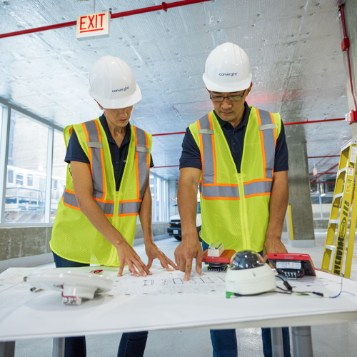 people working on a blueprint