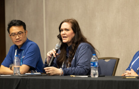 Woman speaking into a microphone