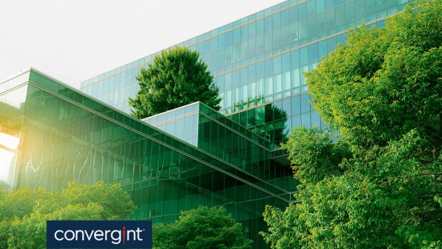 A green tinted building with trees